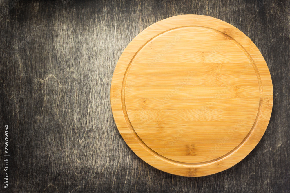 cutting board at old wooden table cutting board at old wooden table
