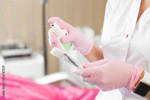 Close up still of hands making desinfaction. Background of sterilization hands, medical equipment and devices. photo