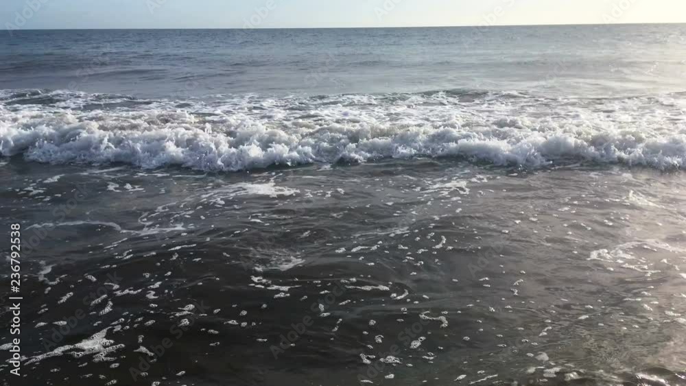 Blue waves surfing on ocean tropical beach Blue waves surfing on ocean tropical beach