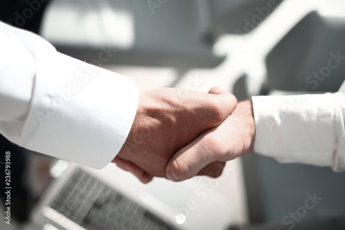 close up.reliable handshake of business partners