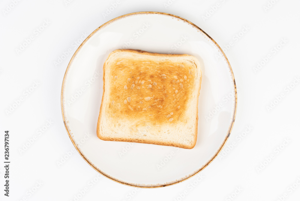 toast on a white plate on a gray background, top view
