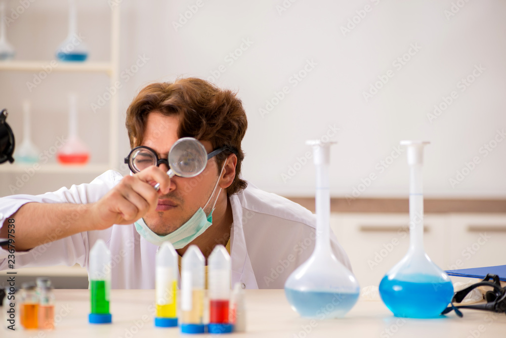 Funny crazy chemist doing experiments and tests Funny crazy chemist doing experiments and tests