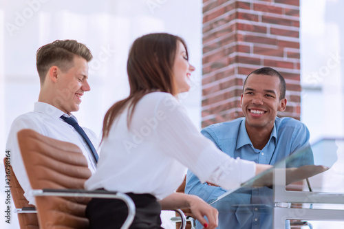 employees discussing new ideas in the workplace