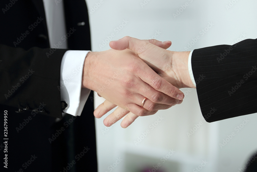 close up. handshake of trading partners on blurred office background close up. handshake of trading partners on blurred office background