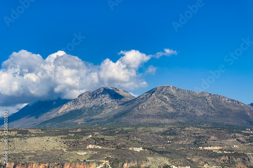 View on small mountains against a clouds