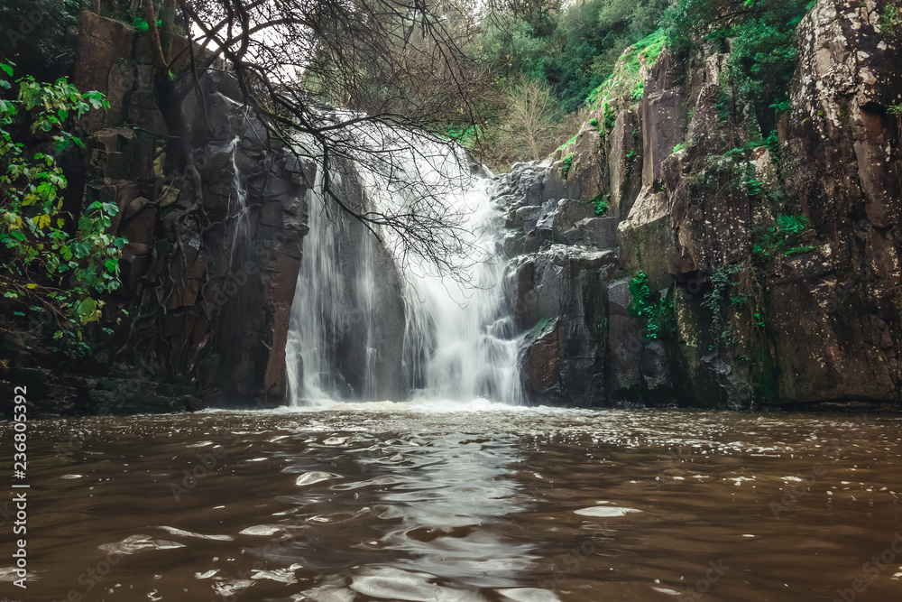 Fototapeta premium Photo of Waterfall mountain view close up. Mountain river waterfall landscape.