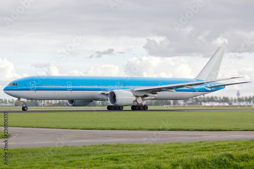 A 777 modern civil airliner on a runway during the take-off roll