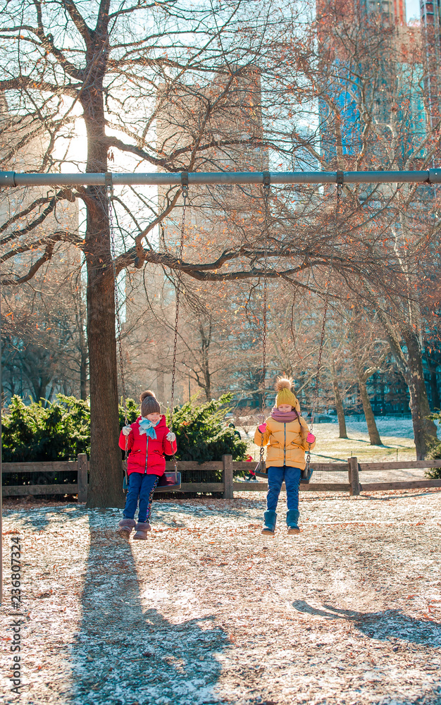 © travnikovstudio - Adorable little girls having fun in Central Park at New York City