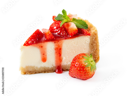 Piece of cheesecake with fresh strawberries and mint isolated on white