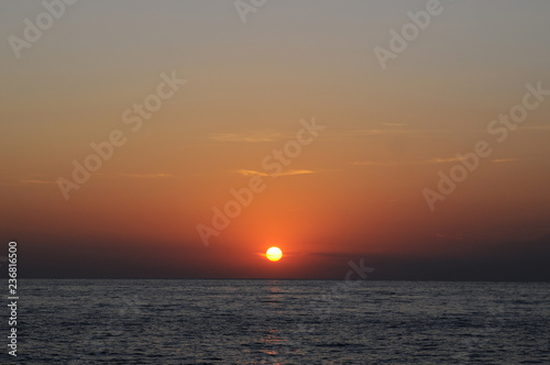 Travel to Slovenia.Travel to Slovenia. Red-orange stunningly beautiful sunset on the Adriatic Sea coast in Slovenia