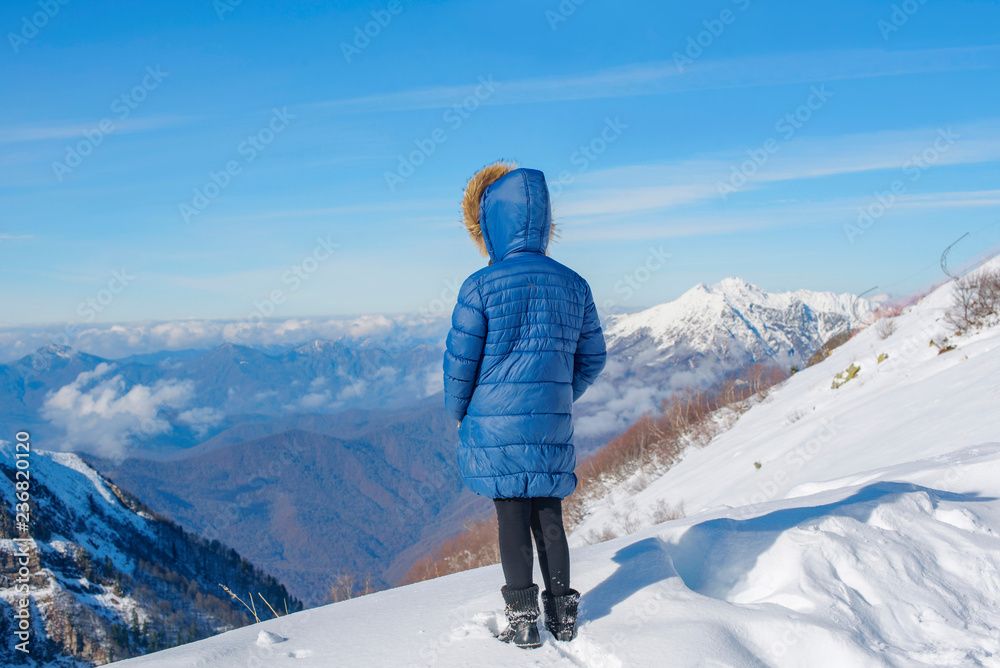 portrait of a girl in the snowy mountains
