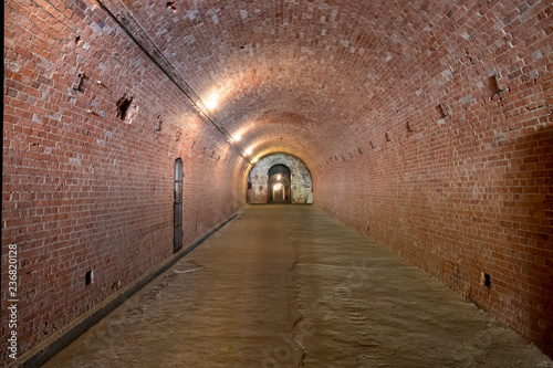 Kaliningrad, Russia - May, 2018. .Brick underground tunnel or corridor with illumination.