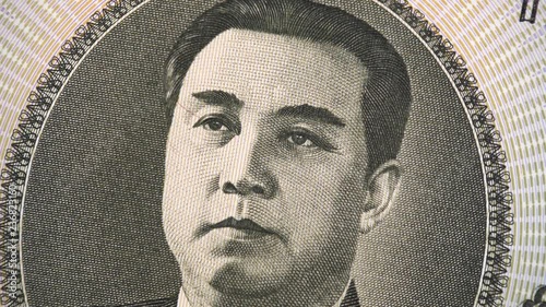 Kim Il sung portrait on North Korean 1000 Won (2006) banknote rotating. 4K UHD video footage.