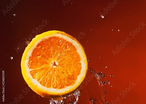 Sliced orange and lemon in water spray