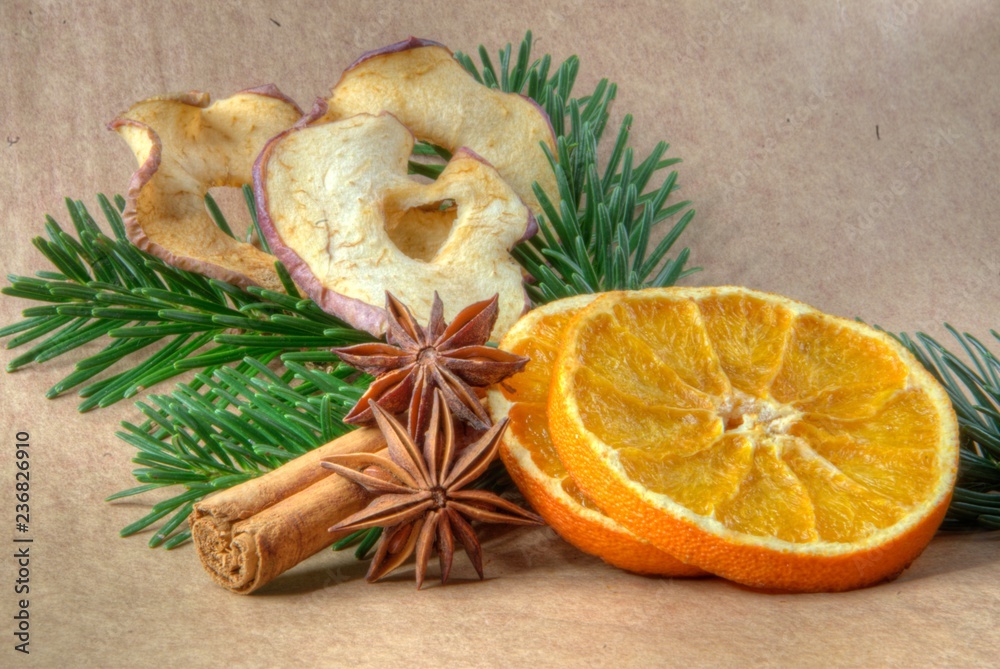 Fototapeta premium Fruits and spices in advent and christmas on brown background