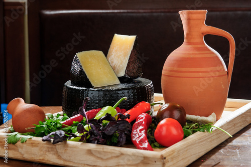 Georgian traditional cheese served with vine. photo