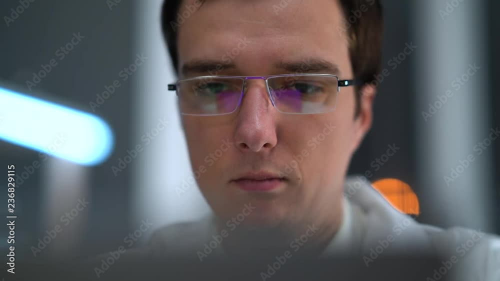 The doctor works in the office in the hospital for a laptop. Looks at the x-ray of the skull. Talking Phone. The doctor works in the office in the hospital for a laptop. Looks at the x-ray of the skull. Talking Phone.