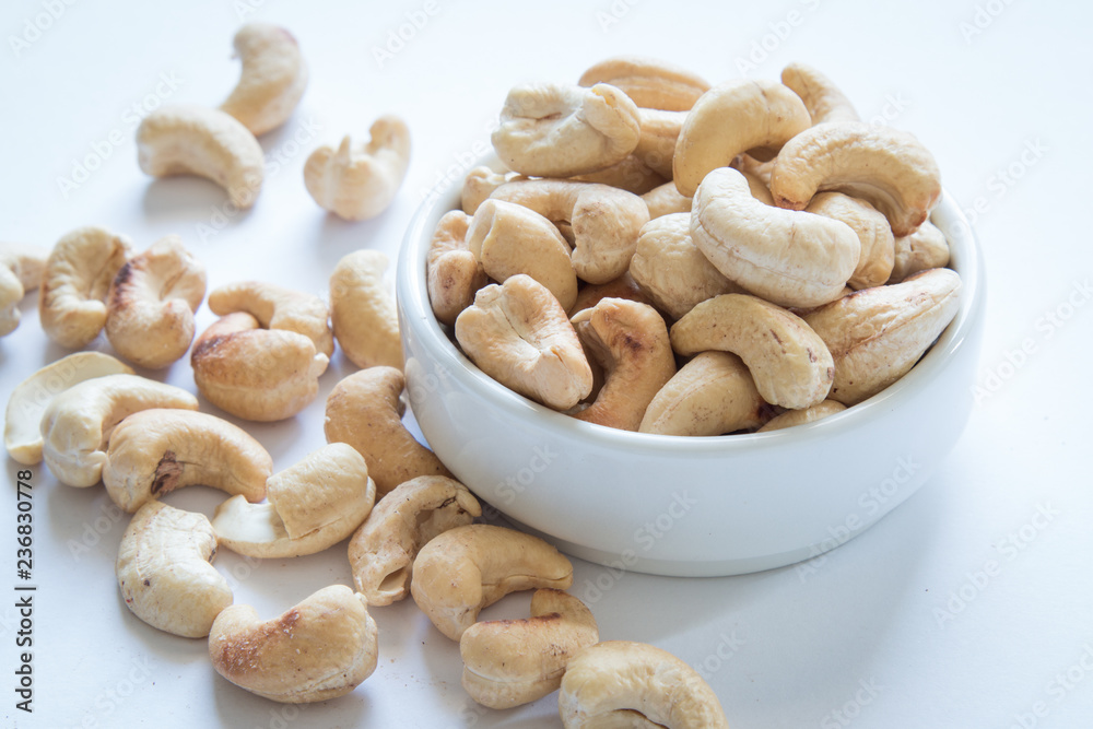 roasted cashew nuts on a white background roasted cashew nuts on a white background