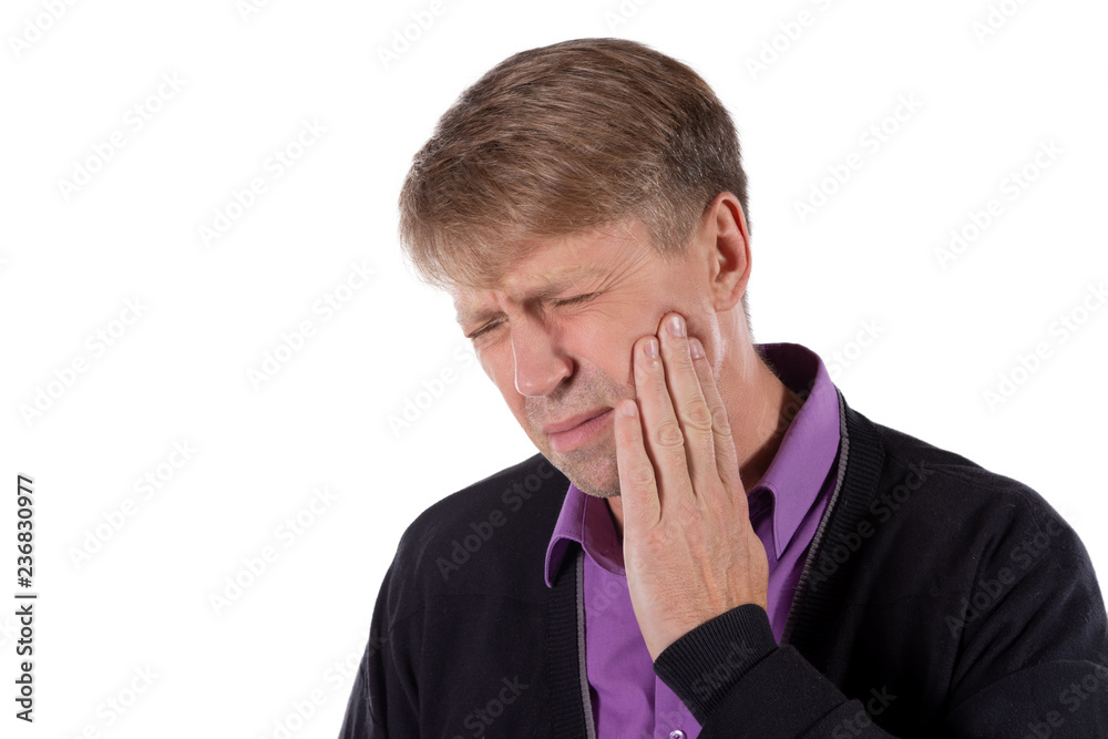 Sad depressed man in pain holding his cheek. Portrait of a man on white background. Emotion facial expression. Feelings and people reaction. Toothache Sad depressed man in pain holding his cheek. Portrait of a man on white background. Emotion facial expression. Feelings and people reaction. Toothache