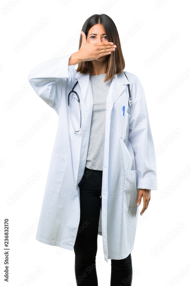 Doctor woman with stethoscope covering mouth with hands for saying something inappropriate. Can not speak on isolated white background Doctor woman with stethoscope covering mouth with hands for saying something inappropriate. Can not speak on isolated white background