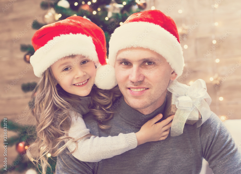 Dad and daughter, Christmas hat, tree, gift box Dad and daughter, Christmas hat, tree, gift box