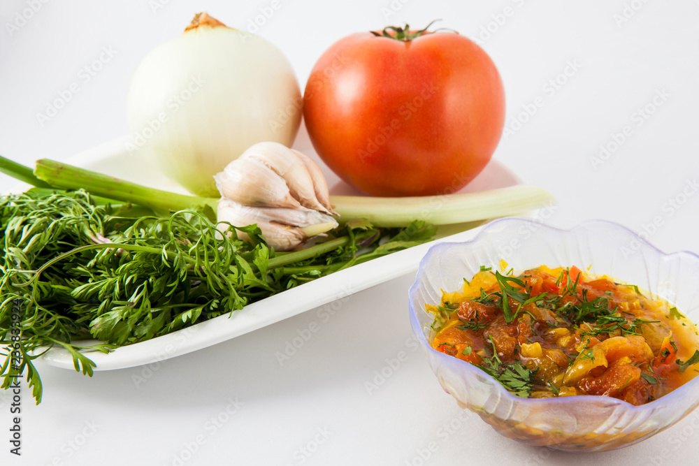 Ingredients to prepare a traditional sauce called hogao used to season the typical Colombian food