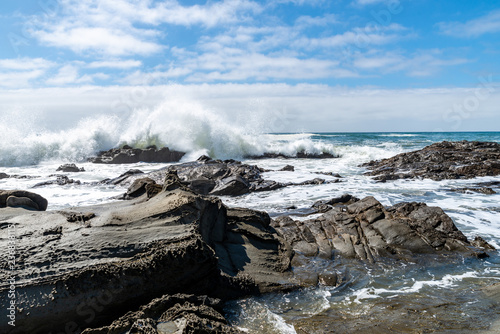 wave with spray on californian coast