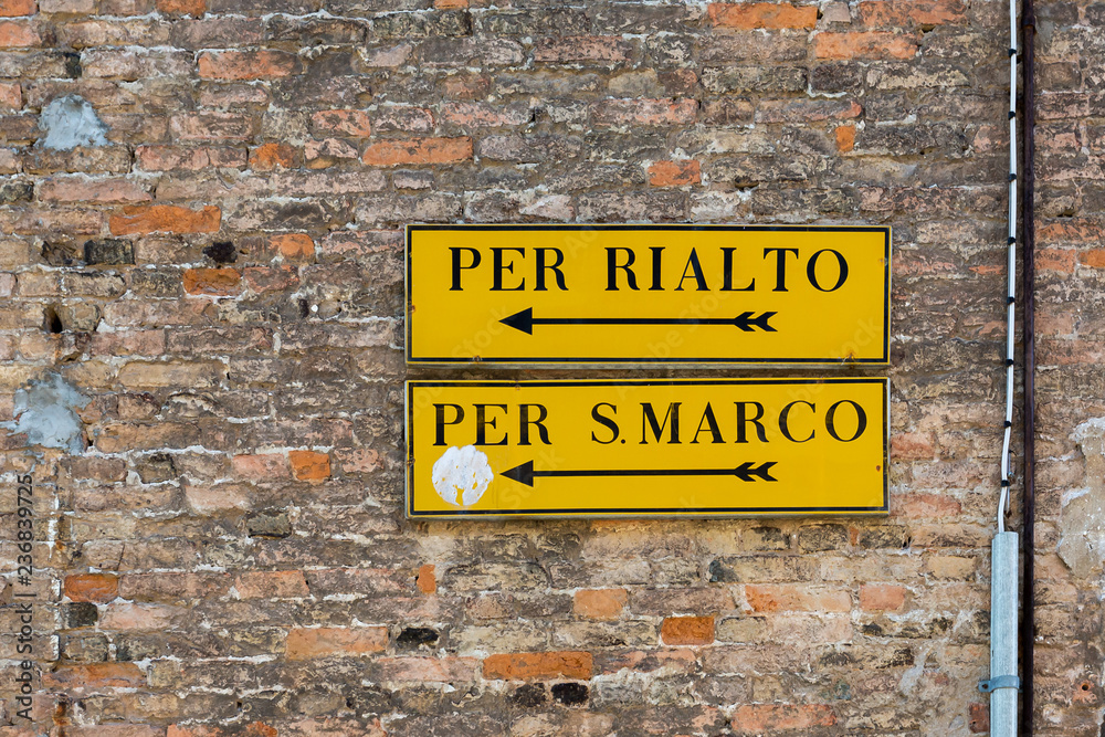 Venice wall mounted direction signs with arrows to Rialto and San Marco Venice wall mounted direction signs with arrows to Rialto and San Marco