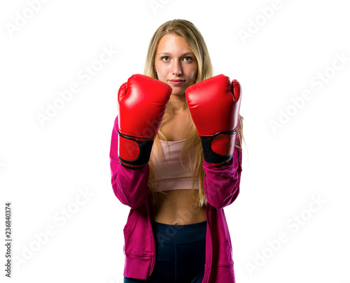 Pretty sport woman with boxing gloves on isolated white background