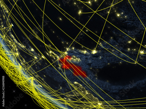 Tajikistan on planet Earth from space at night with network. Concept of international communication, technology and travel. photo