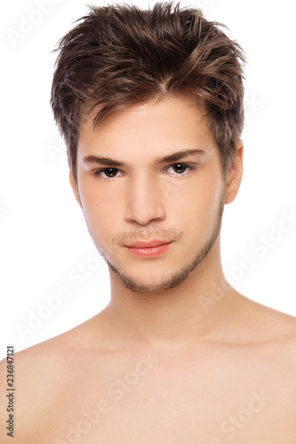 Portrait of young handsome man with messy hairstyle