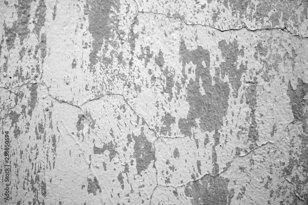 Texture of old cracked wall. Grey color.
