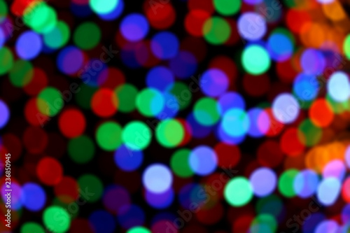 Festive Christmas background with colorful defocused bokeh lights. 