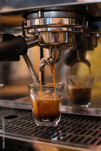 espresso machine pouring espresso, barista on work, cafe scene, making espresso