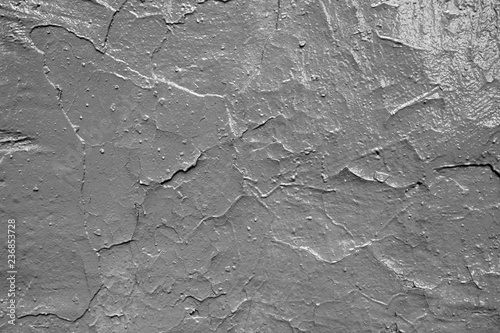 The texture of the old cracked wall. Painted in grey.