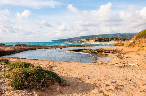 Wild beach with cliffs and rocks inside the Mediterranean Sea in North Israel near Rosh Hanikra