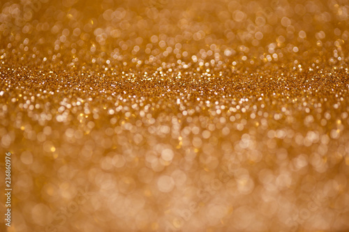 Defocused abstract golden christmas background with blinking lights
