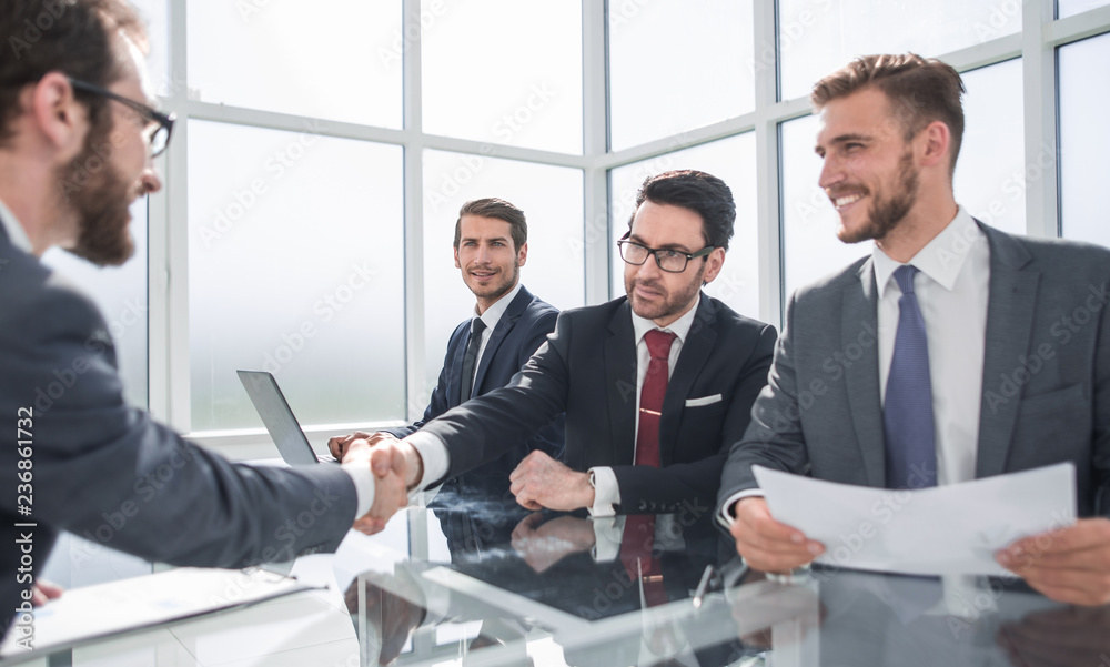 handshake of business people at a working meeting handshake of business people at a working meeting