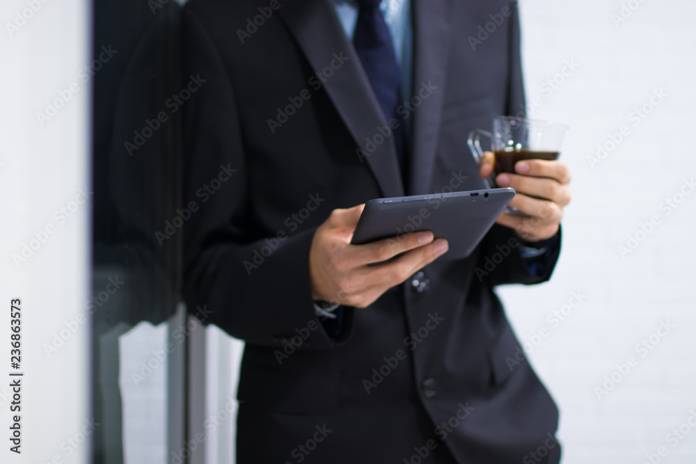 business man with tablet or computer and coffee mug business man with tablet or computer and coffee mug