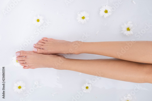 Beautiful female legs and feet in the bath.