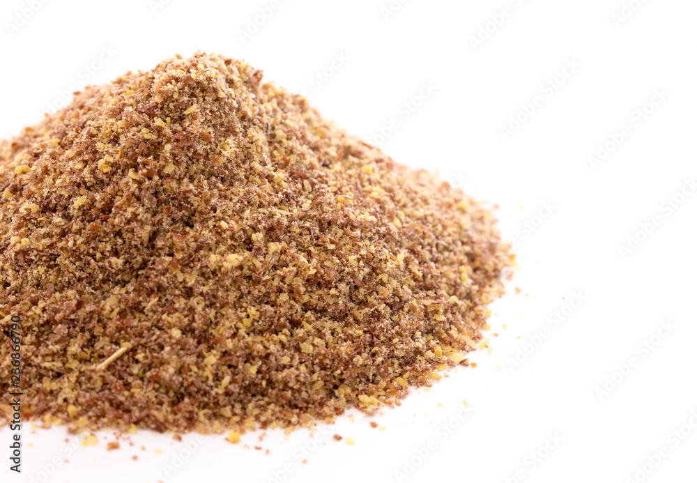 Pile of Ground Flax Seeds on a White Background Pile of Ground Flax Seeds on a White Background