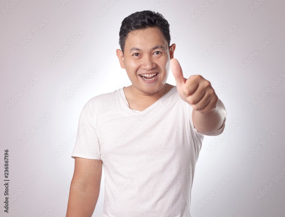 Young Man Showing Thumbs Up Gesture OK Sign Young Man Showing Thumbs Up Gesture OK Sign