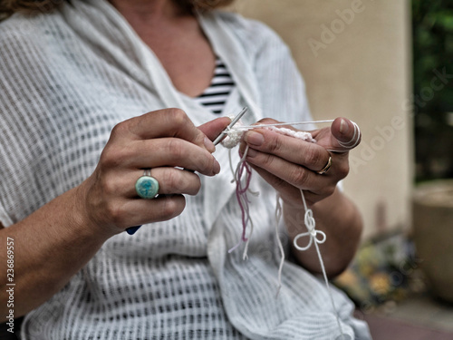 Woman's hands knitting. Handcraft concept.
