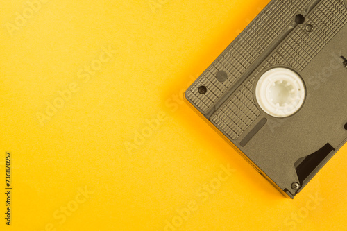 Video cassette isolated on yellow background. vhs with copy space