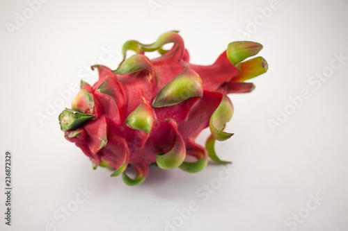 Exotic ripe pink Pitaya or Dragon fruit on white background