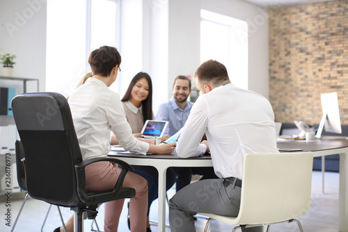 Office employees having meeting in conference room. Finance trading