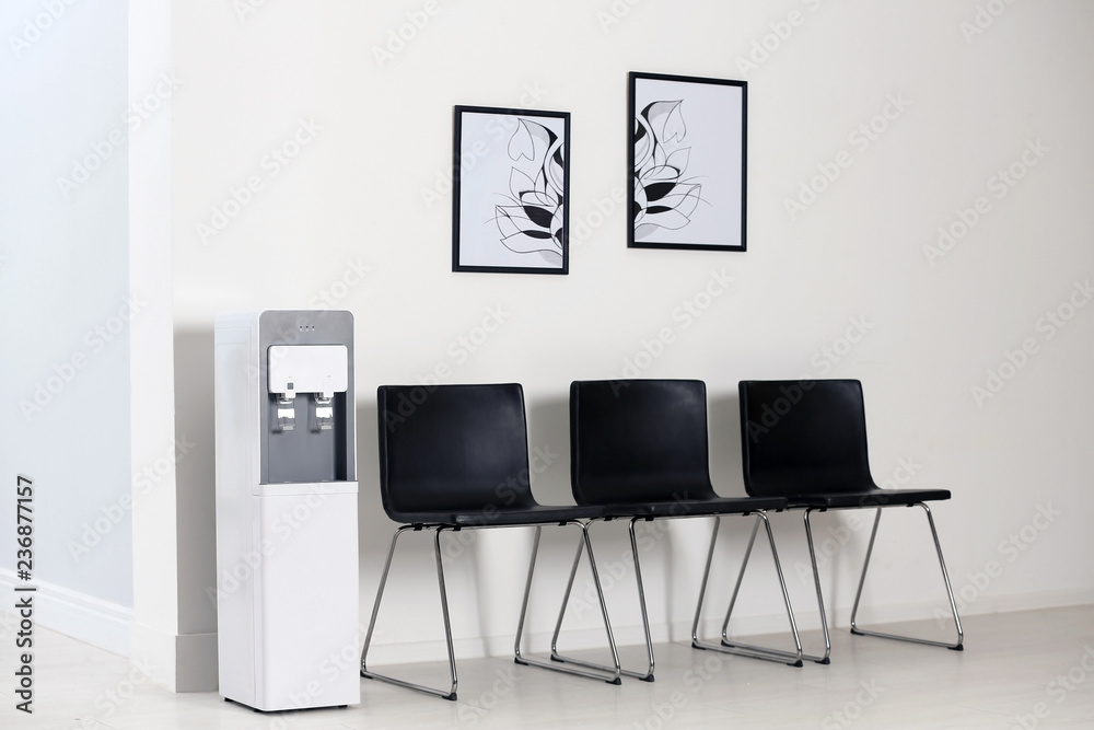 Modern water cooler in stylish office interior Modern water cooler in stylish office interior