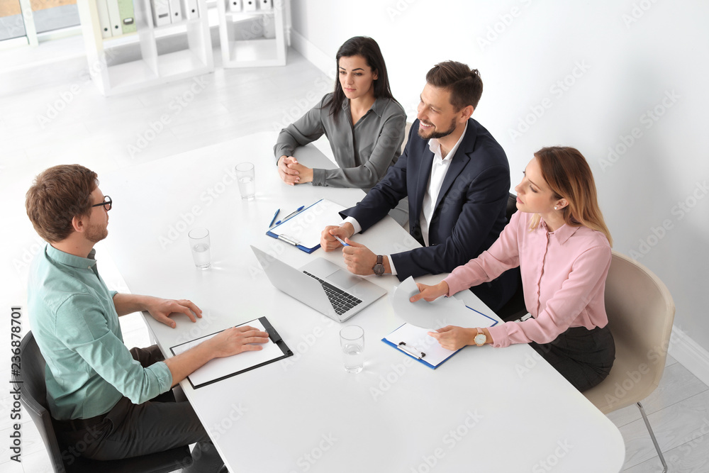 Human resources commission conducting job interview with applicant in office Human resources commission conducting job interview with applicant in office