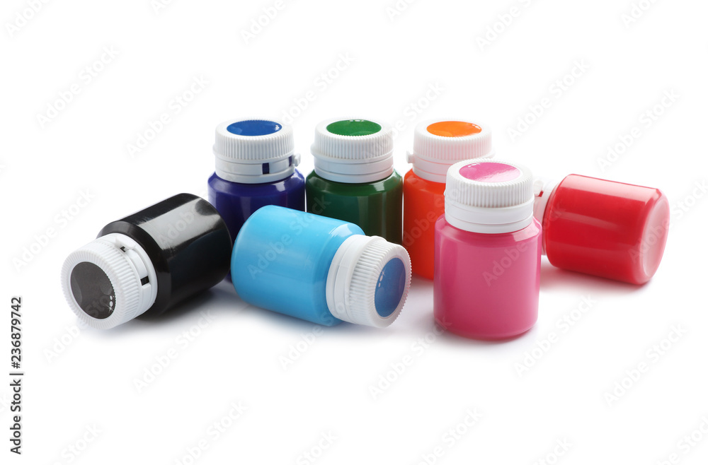Jars with colorful paints on white background. Artistic equipment for children Jars with colorful paints on white background. Artistic equipment for children