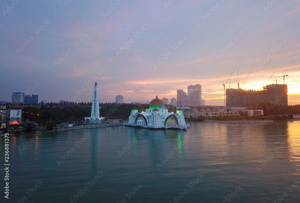 Aerial view of Majestic Malacca Straits Mosque during sunset.